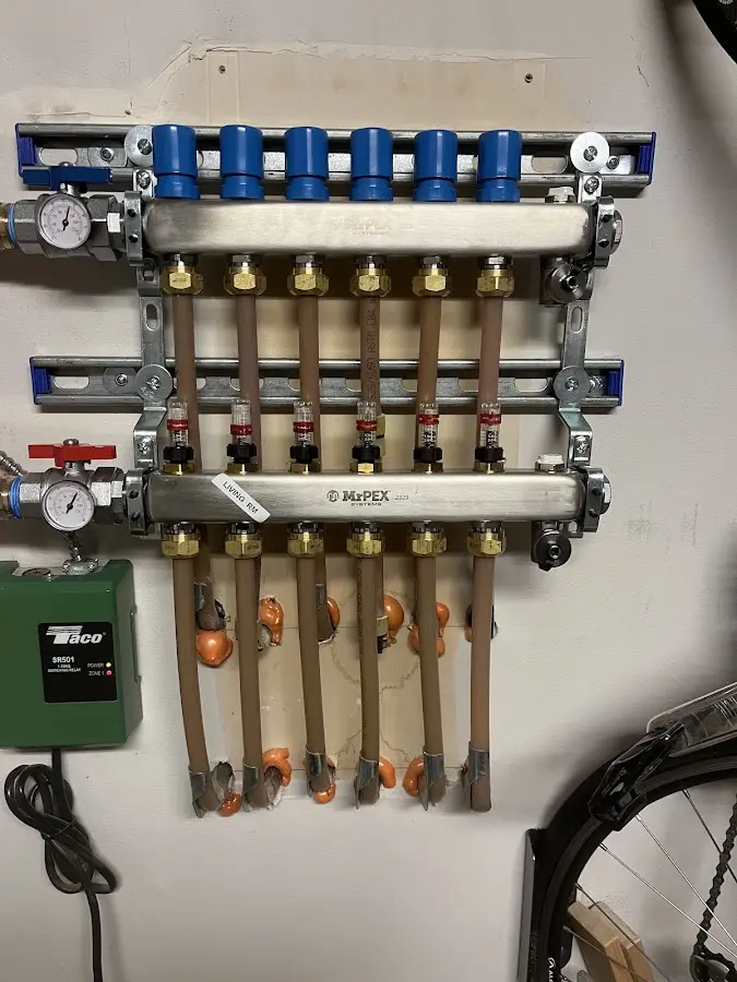 Plumber performing Water Heater Repair at a residential property in Lyon